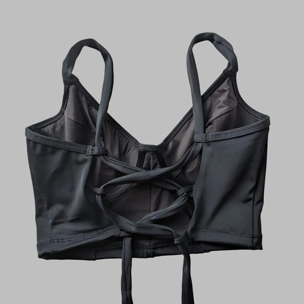 Bustier negro con soporte y barba, copas B a D, vista espalda ajustable— Kinibe